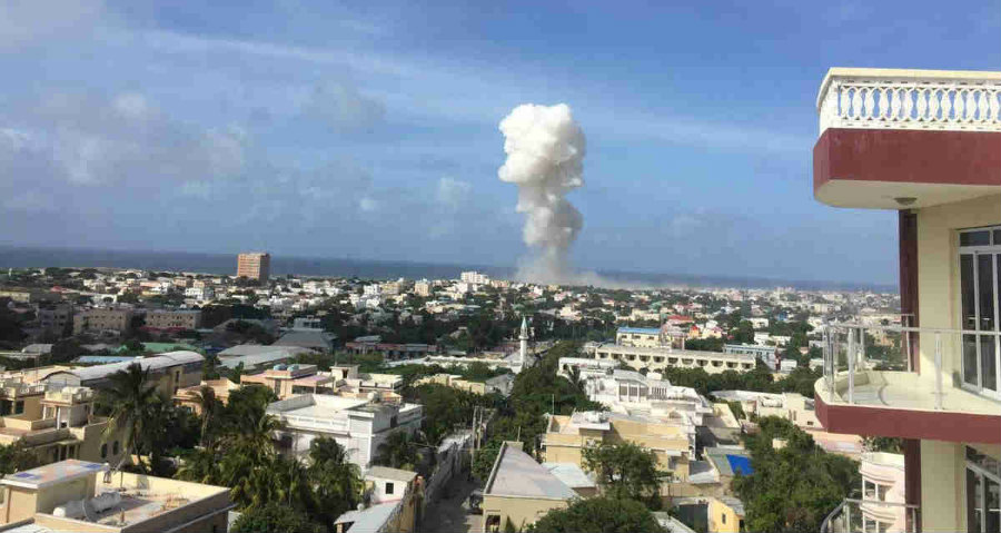 A picture taken far away from the dual car bombing attack's ground zero. The attack credited to Al-Shabab took the lives of thirteen people who were transitting at the time. Image Credit: Twitter