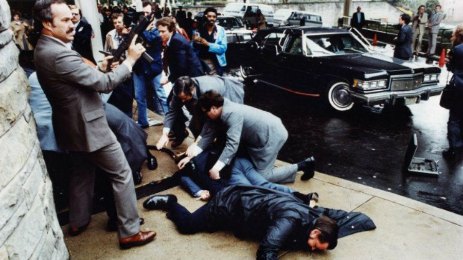 A photo of the moment when Hinckley shot at President Reagan on March 30, 1981. Fortunately for Reagan, Hinckley's shot didn't get to him, yet it was a close call. Image Credit: Stuff