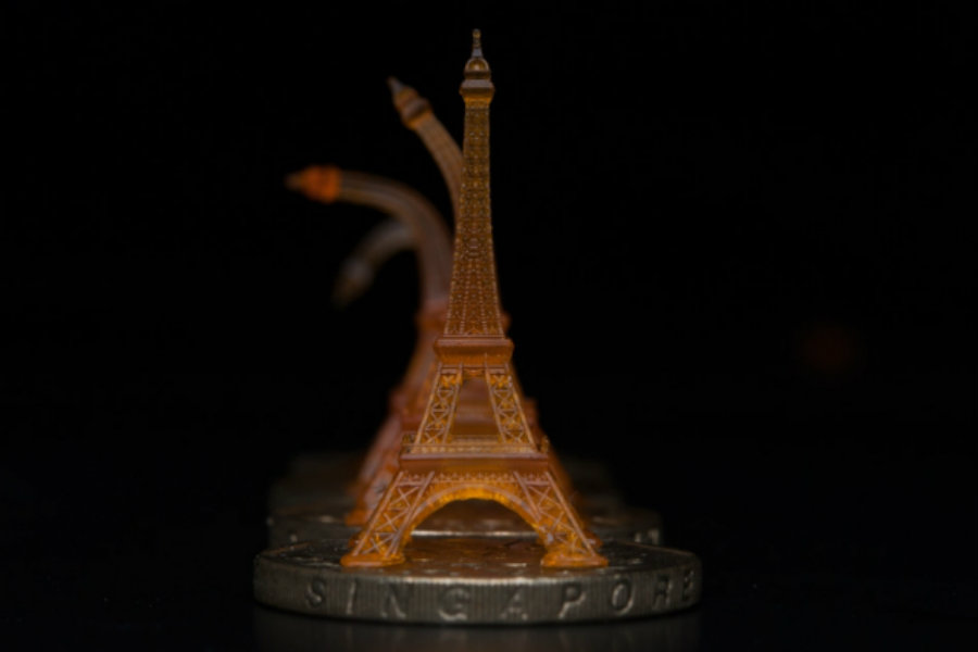 A 3D-printed replica of an Eiffel Tower goes back to its original form after being deformed. Image Credit: MIT News