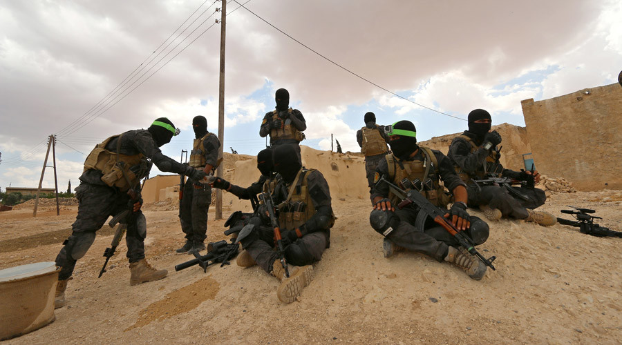 Syria Democratic Forces fighters take positions as they await U.S.-led airstrikes on ISIS strongholds. Image Credit: RT