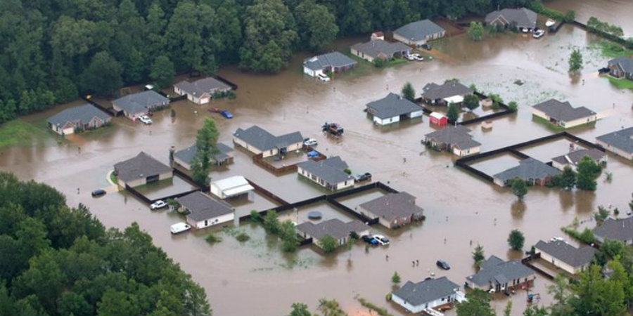 This aerial photo shows flooded homes along the Tangipahoa River near Amite, Louisiana. Image Credit: Business Insider