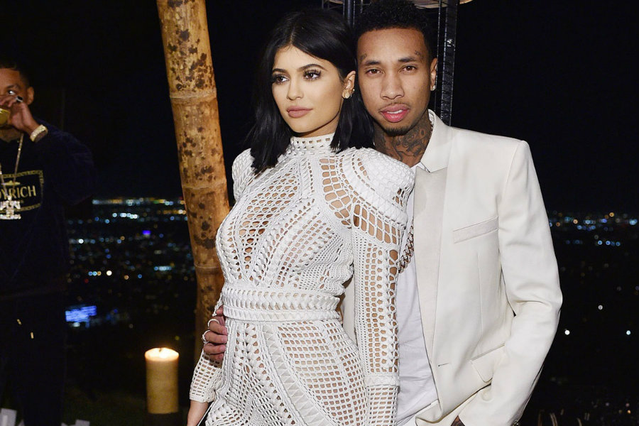 Rumors about engagement between Kylie Jenner and the rapper Tyga began when people spotted a shiny ring in Kylie's hand, which she has been using for a few days. Photo credit: In Touch Weekly 